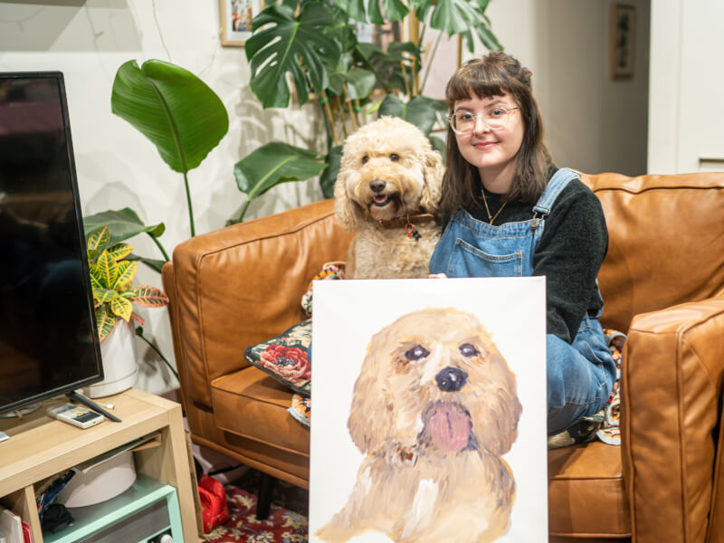 woman smiling with pet and pet portrait